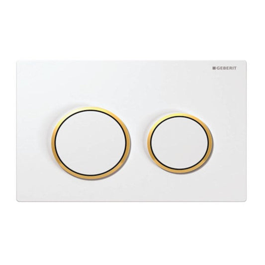 Geberit Omega 20 Dual Flush Actuator with a white and gold finish, wall-mounted, with the brand and model number visible.