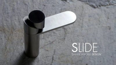 'Slide' Modern faucet on a stone background